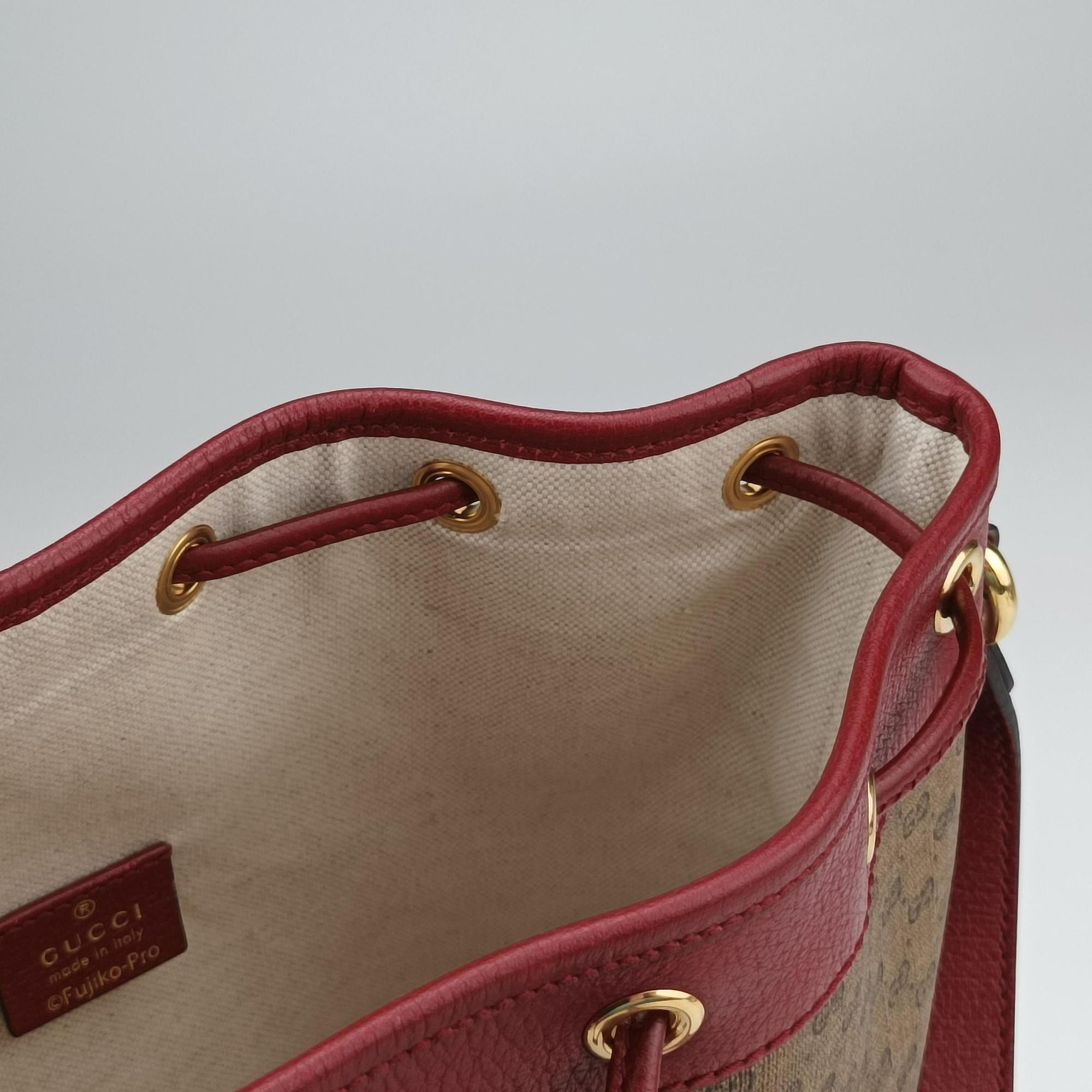Doraemon collaboration Brown x red PVC coated canvas×Leather 655597 G034362479ドラえもんコラボ ブラウンxレッド PVCコーティングキャンバス×レザー 655597 G034362479