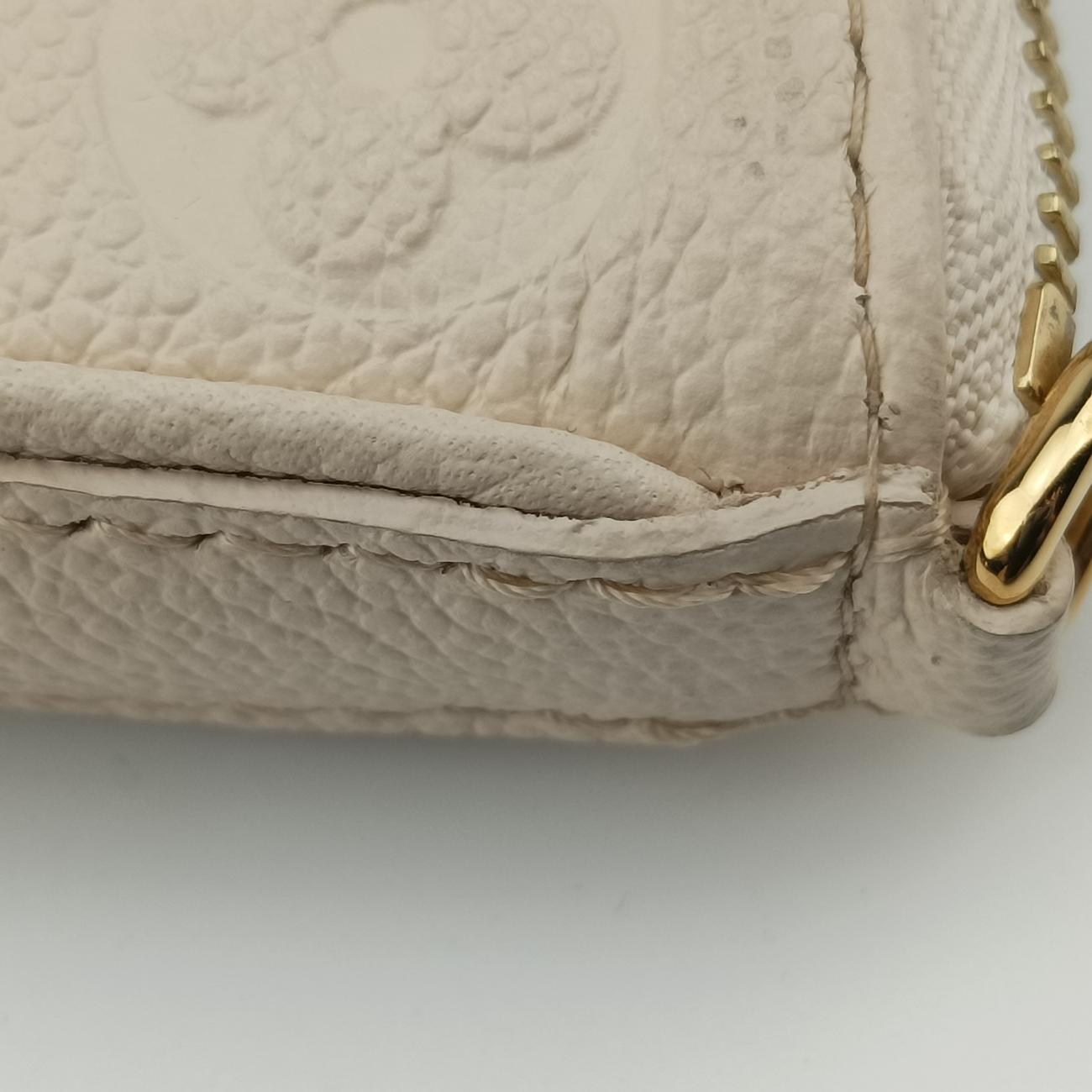 Easy PouchCrème WhiteEmbossed MonogramM81066ICチップイージーポーチクレームホワイト モノグラム アンプラントM81066ICチップ