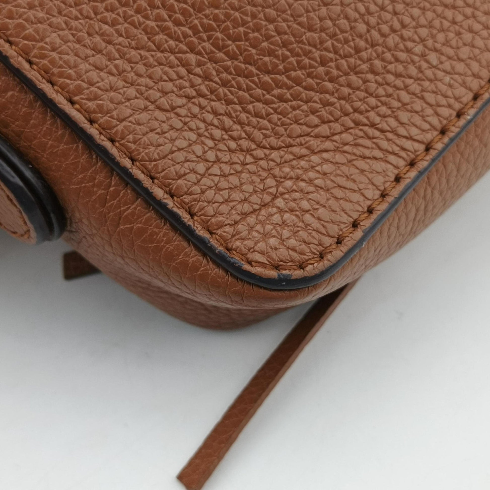 Joan Brown Suede × Leather 03-20-86585リボットホースヘッドフラップ ブラウン スエード × レザー ジョアン 03-20-86585
