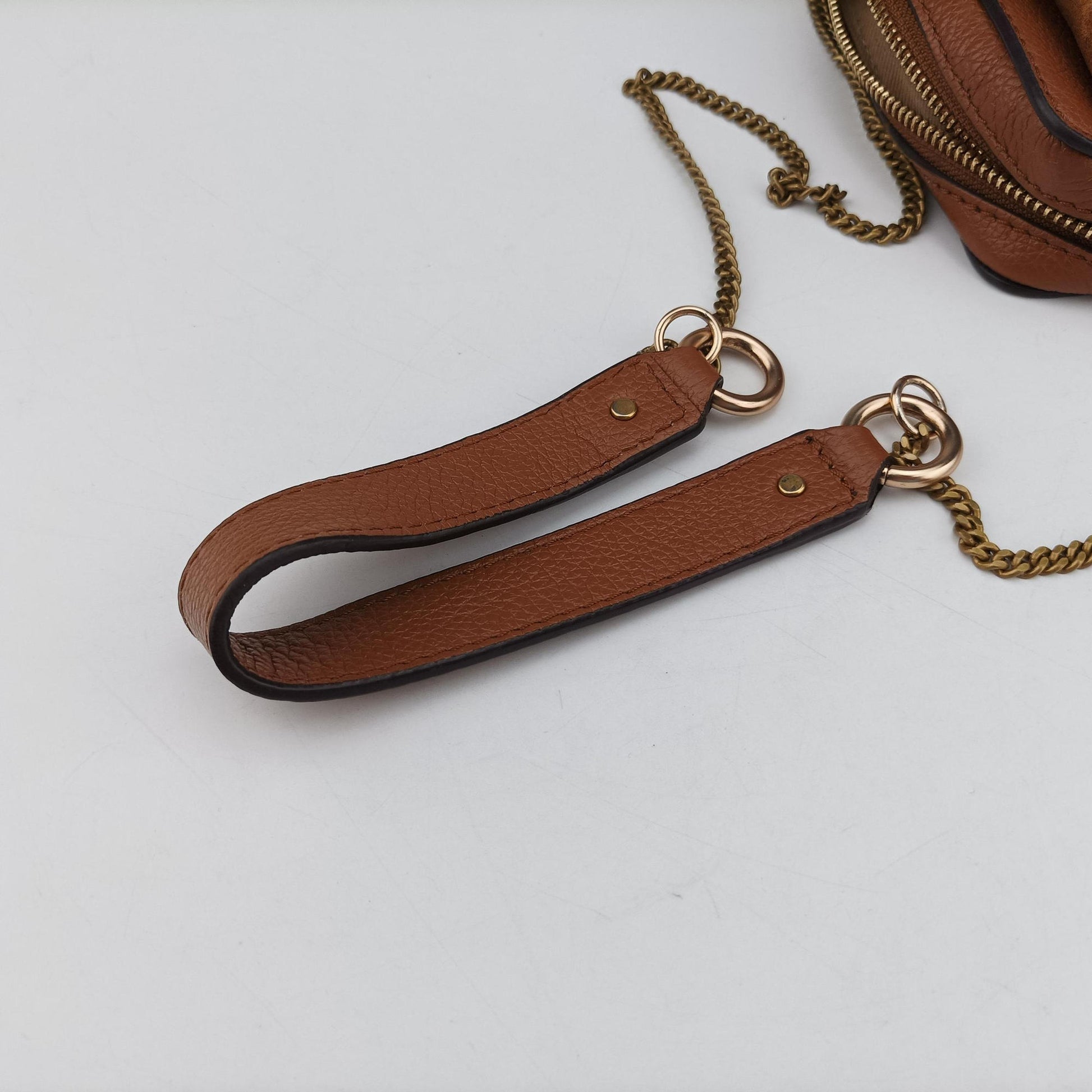 Joan Brown Suede × Leather 03-20-86585リボットホースヘッドフラップ ブラウン スエード × レザー ジョアン 03-20-86585